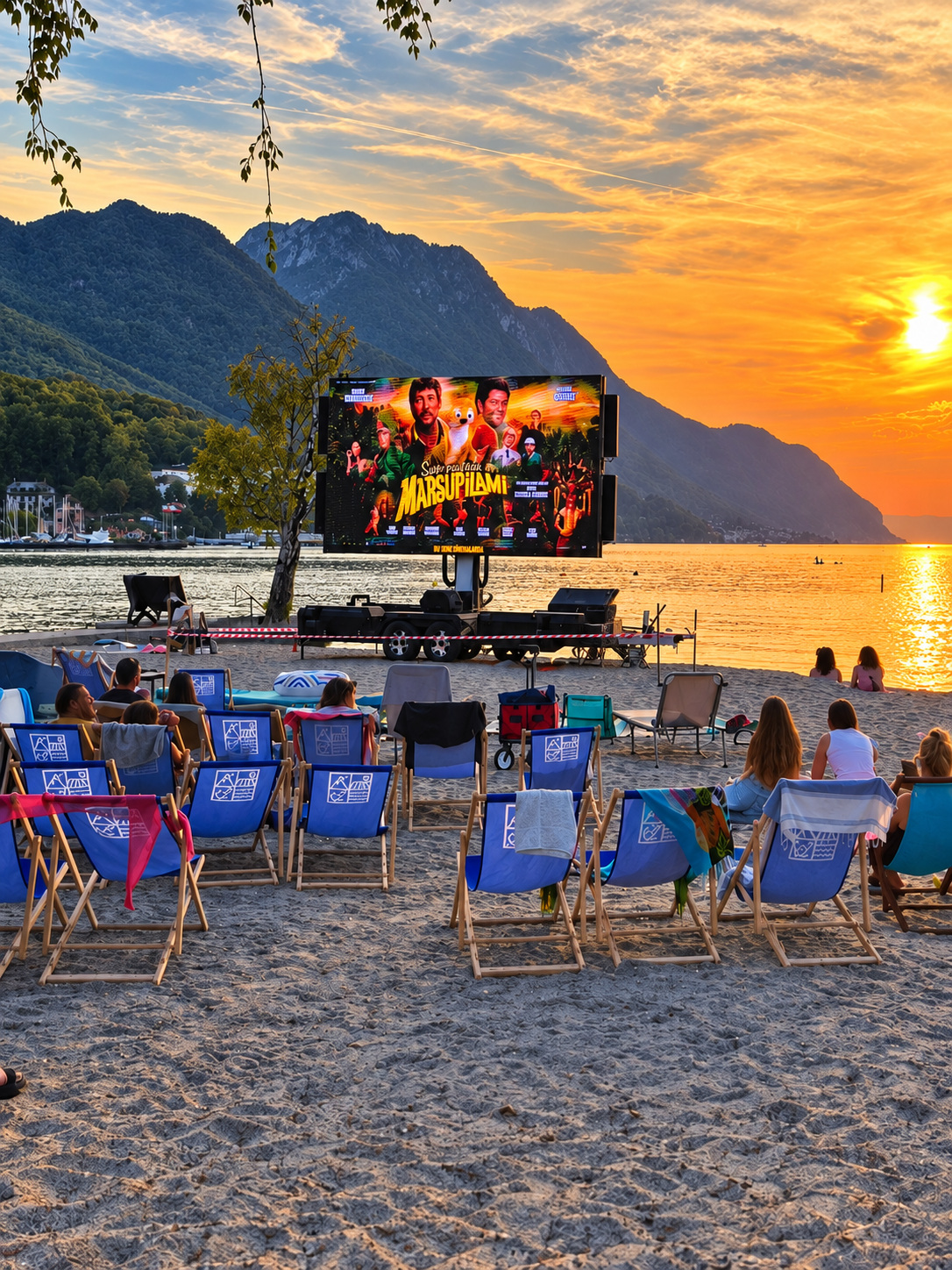 Écran LED installé au bord d’un lac au coucher du soleil